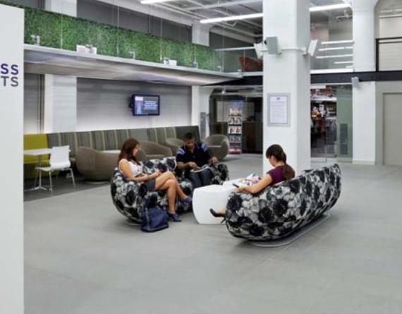 students on couches in a lounge