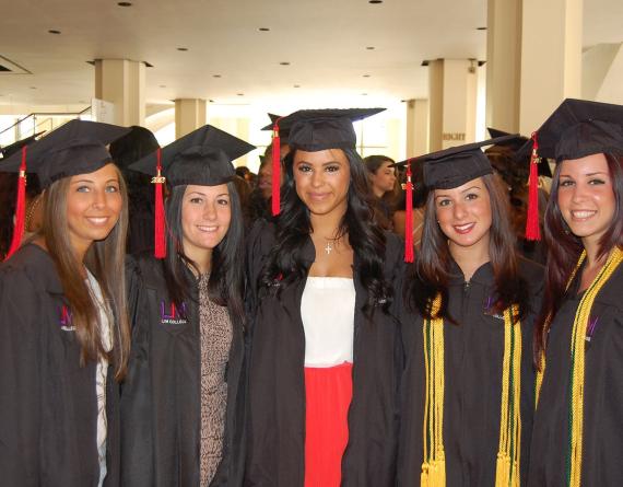 group of girls in graduation caps and gowns