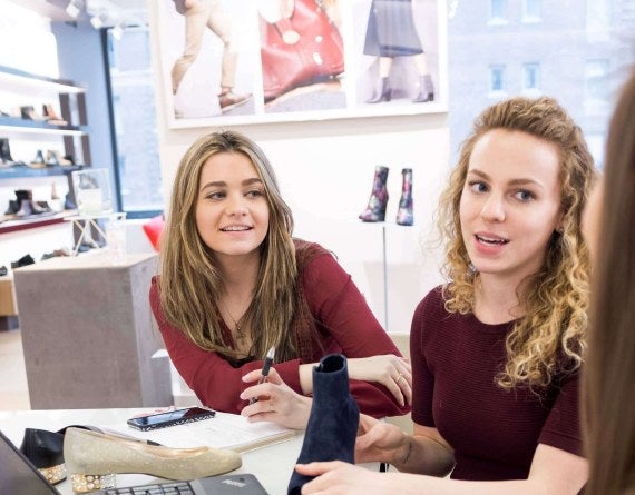 LIM student interns examine shoes at a showroom