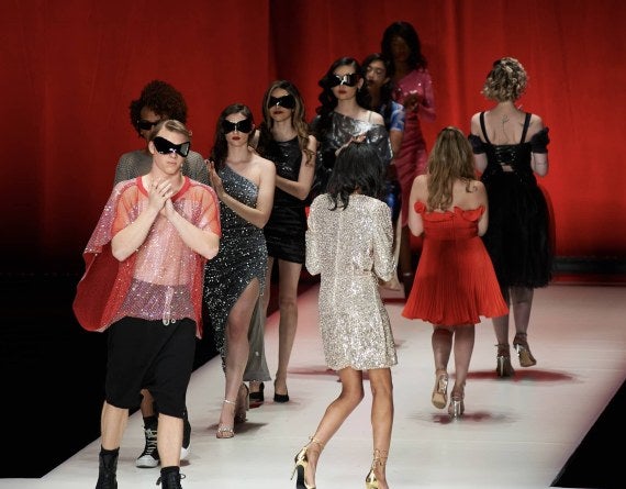 Models perform the lap clap after the 2023 Fashion Show