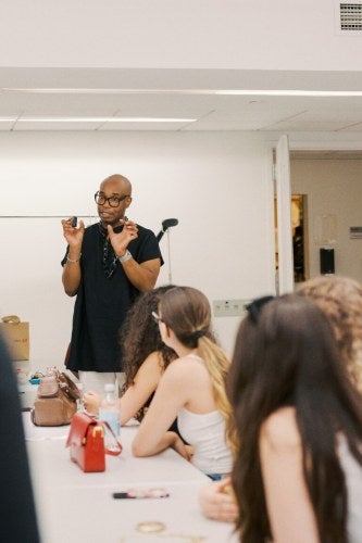 Professor Spence teaching Fashion Academy Class
