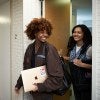 2 students in the hallway of FOUND Study
