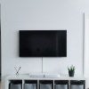 flatscreen tv against a white wall in a home
