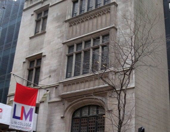 brick building with LIM flag